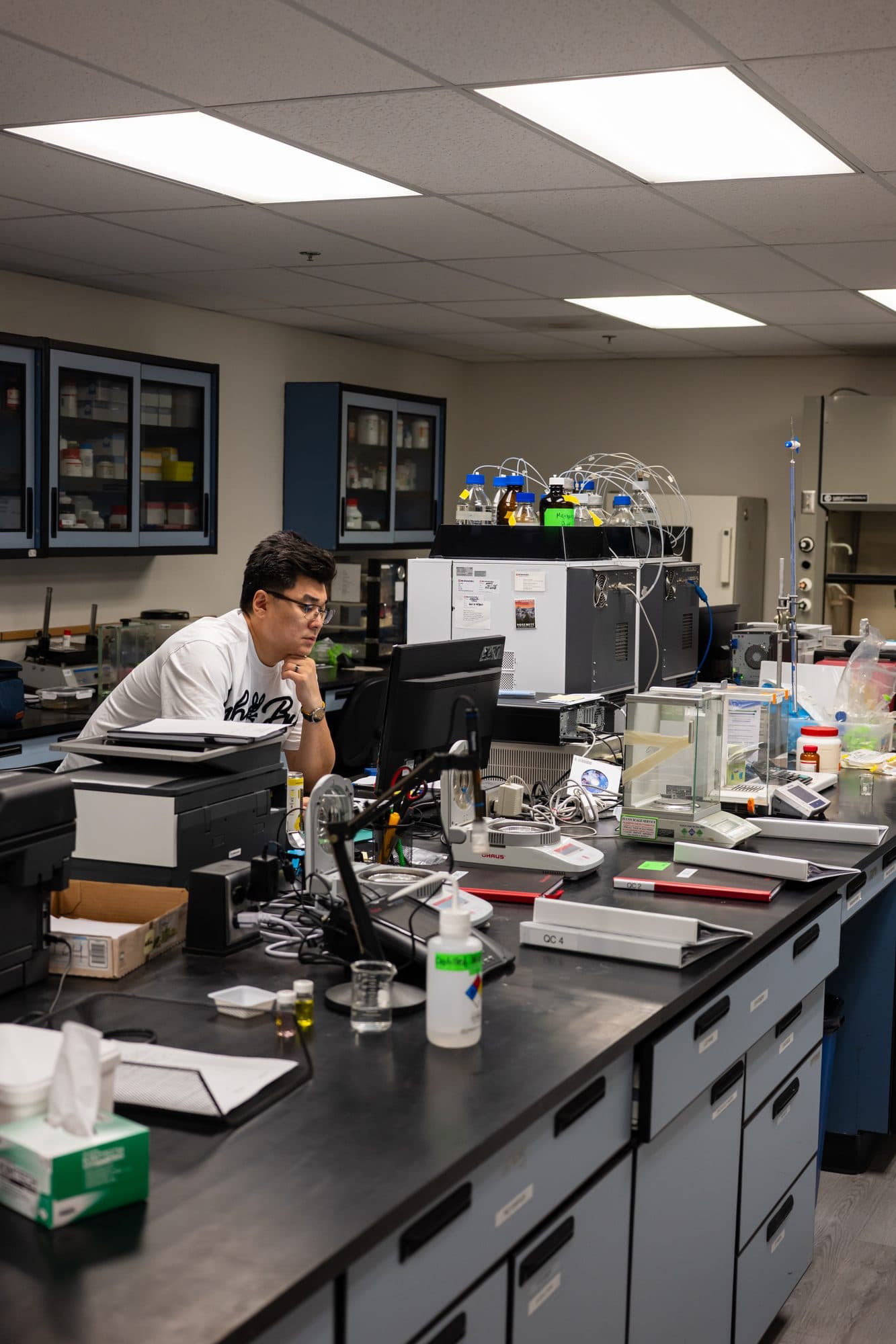 A Pure Source technician formulating at the fume hood